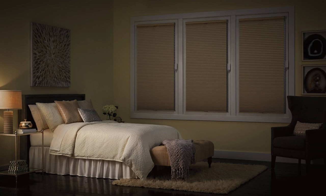 Dark bedroom outfitted with Hunter Douglas Duette® Cellular Shades near Dallas, TX