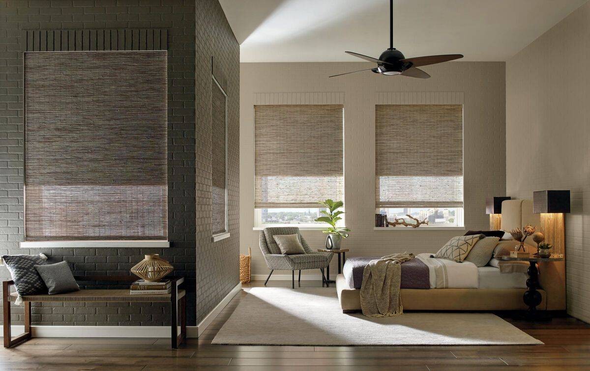 Hunter Douglas Provenance® Woven Wood Shades adorning a home’s living room windows