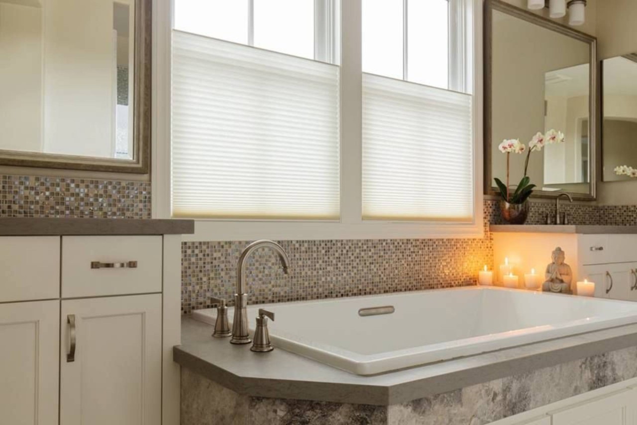 Hunter Douglas Duette® Cellular Shads hanging in a bathroom window near Dallas, TX