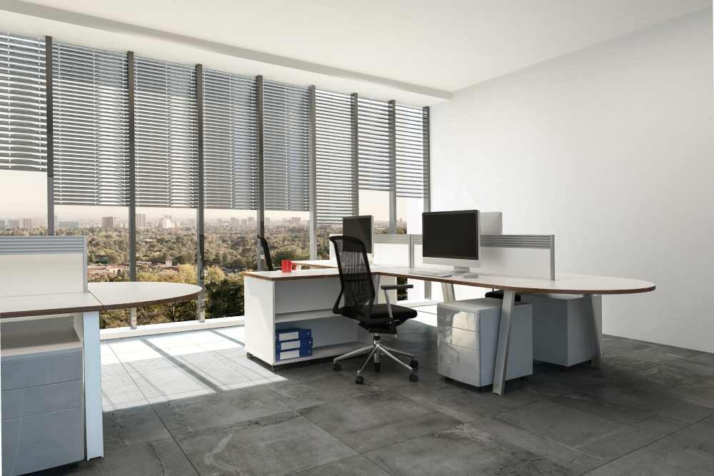 Commercial Blinds in an office with floor-to-ceiling windows